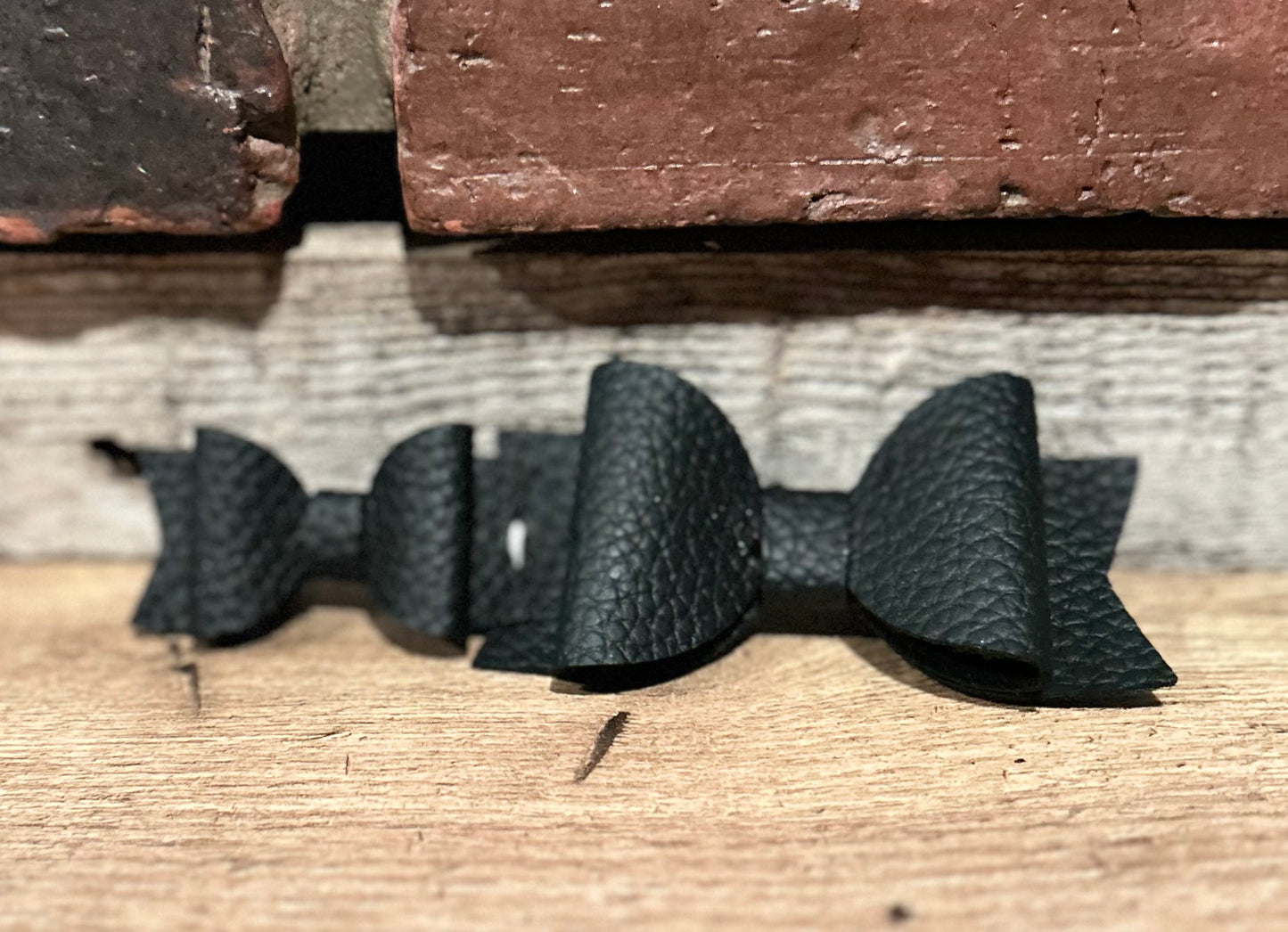 Black Pebble Faux Leather Bow